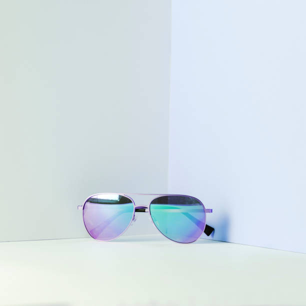istock Stylish blue aviator sunglasses on modern minimal background, front view. Nobody. 1266499438