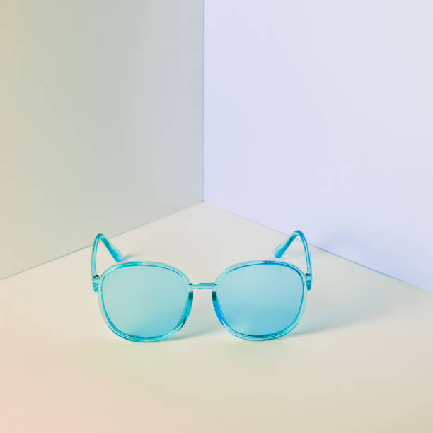istock Stylish blue sunglasses on modern minimal pastel background, front view. Nobody. Product photograph 1266499446