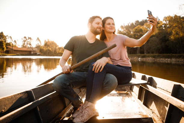 istock romantic couple in rowing boat 1266501247