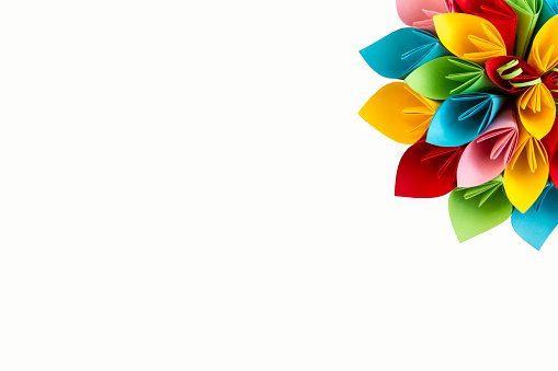 paper flower color; side, in the upper right corner, a white sheet of paper; paper; made; isolated;