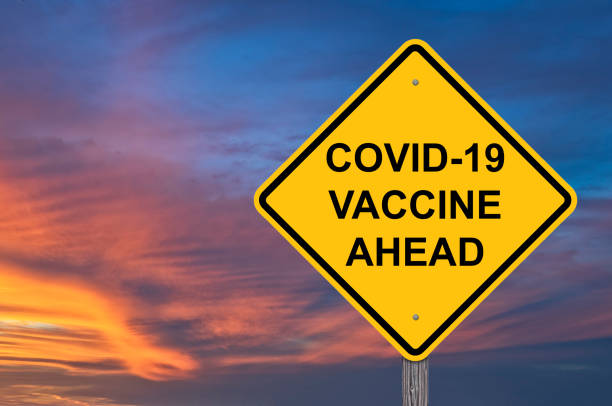 istock Covid-19 Vaccine Ahead Sign 1266504935