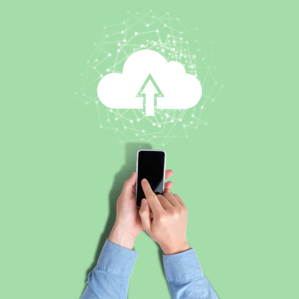 istock Concept of uploading data from phone to cloud service 1266505188