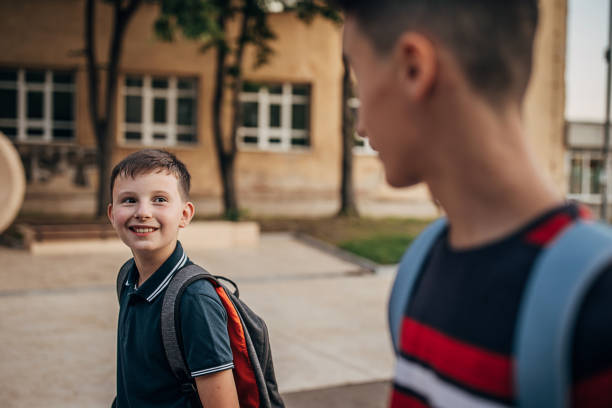 istock Two young boys going to school together 1266506035