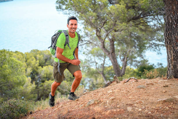 istock Active Mature Spanish Male Hiking Up Coastal Trail 1266510052