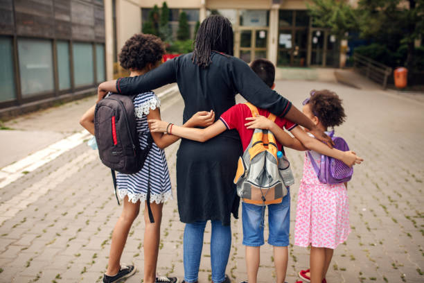 istock Mother taking kids to school 1266512294