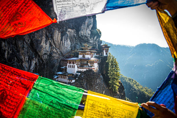 istock Hidden Tiger Nest Monastery Among The Flaying Prayer Flags 1266522631
