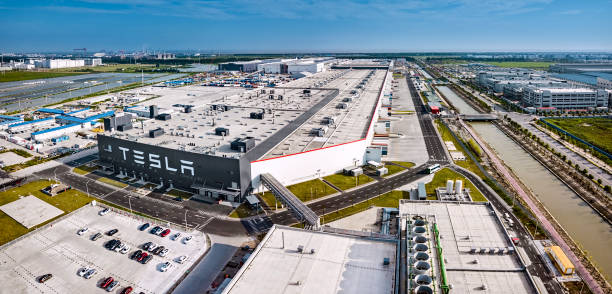 Tesla Shanghai automobile factory Shanghai, China - August 1, 2020: Exterior view of automobile plant Tesla Gigafactory 3 located in Pudong District, Shanghai, China. tesla model x stock pictures, royalty-free photos & images