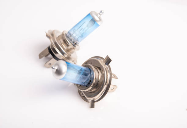 istock Car headlight bulb h4 technology, blue light, light cut system and very bright on white background 1266528755