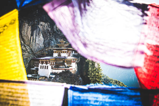 istock Hidden Tiger Nest Monastery Among The Flaying Prayer Flags 1266528785