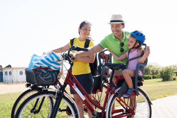 istock Family Riding Bicycle Outside 1266532220