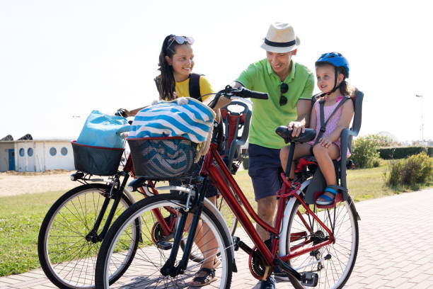 istock Family Riding Bicycle Outside 1266532230