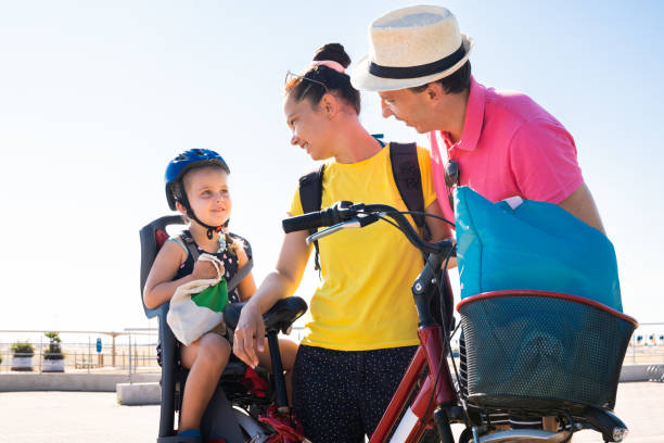 istock Family Riding Bicycle Outside 1266532245