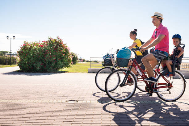 istock Family Riding Bicycle Outside 1266532246