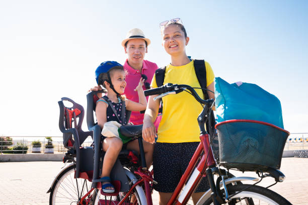 istock Family Riding Bicycle Outside 1266532249