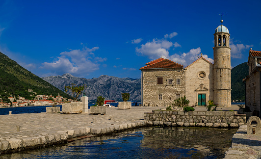 Panoramic view of Our Lady of the Rocks church on a man-made island in the famous Kotor Bay near Perast, Montenegro