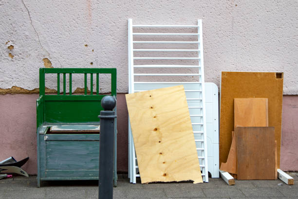 istock Bulky waste with an old wooden bench, boards and a cot 1266544872