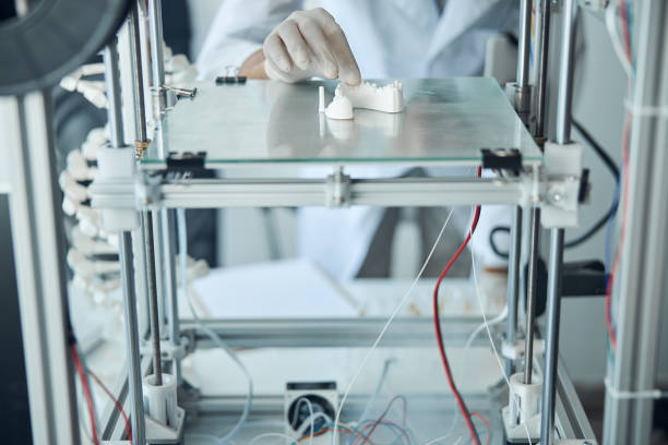 istock Experienced male scientist examining the dental model 1266545700