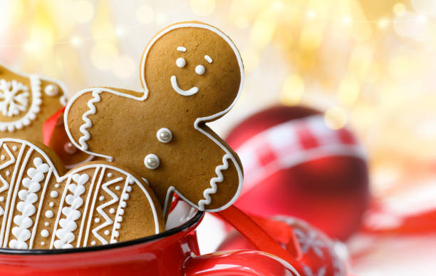 Gingerbread cookie men in a red cup