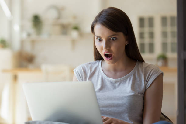 istock Young female freelancer feeling shocked loosing results of her work 1266551898