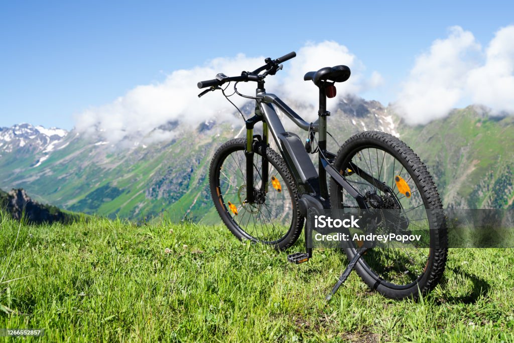 E Bike In Austria. Ebike Cycling E Bike In Austria. Ebike Cycling In Mountains Electric Bicycle Stock Photo