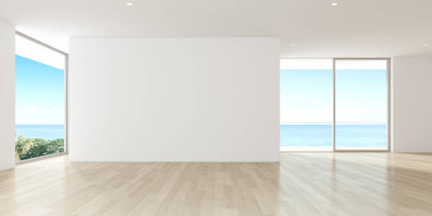 istock Modern empty room with wooden floor and large plain wall on sea background. 3d render. 1266560047