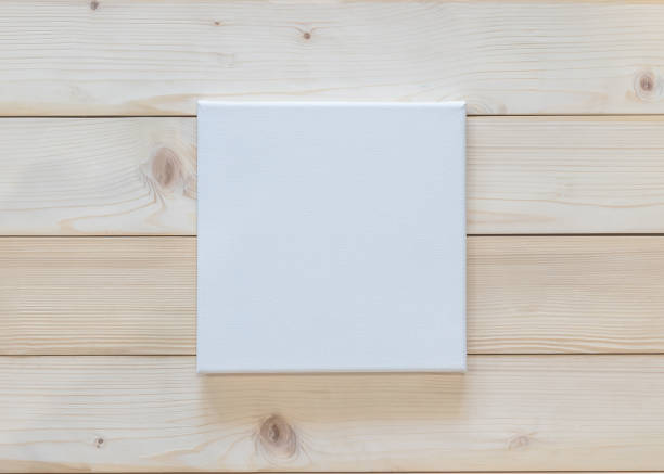 istock Blank canvas frame mockup rectangular size on white wood wall for arts painting and photo hanging interior decoration 1266564462