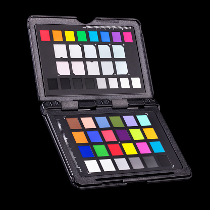 Rainbow color palette or colorchecker calibration passport for post production in photography isolated on black background with clipping path