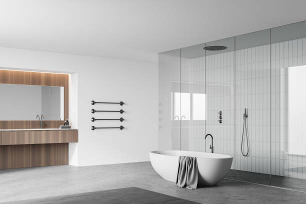 istock White bathroom corner with tub, sink and shower 1266566767