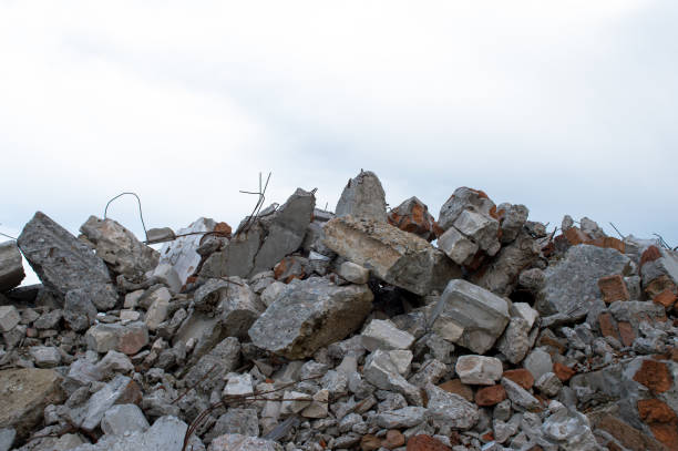 istock Concrete fragments of a construction structure against the gray sky. Background 1266566963