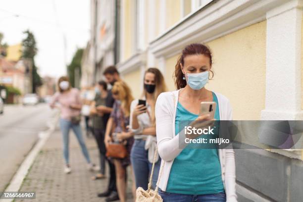 Waiting In Line Social Distancing Stock Photo - Download Image Now - Waiting In Line, Protective Face Mask, People