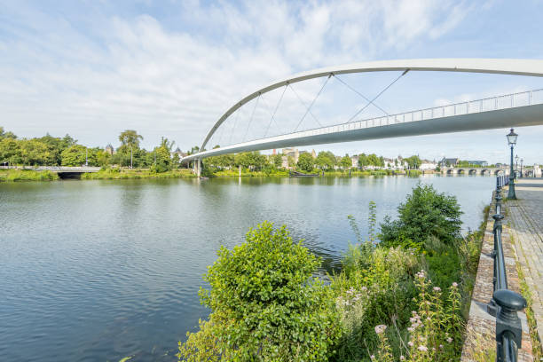 istock Maas river with the High Bridge (Hoge Brug) surrounded by trees with the St. Servatius Bridge (Sint Servaasbrug) and the center of Maastricht in the background 1266569301