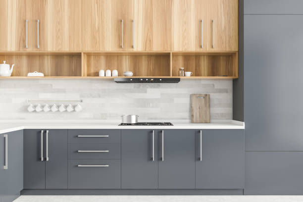 istock Gray countertops in white kitchen interior 1266569491