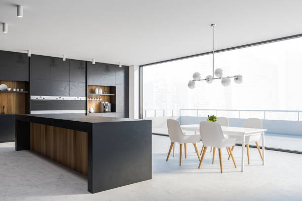 istock Black kitchen corner with bar, table and balcony 1266570591