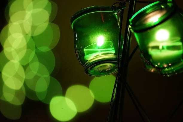 Green light of the candle which entered the glass