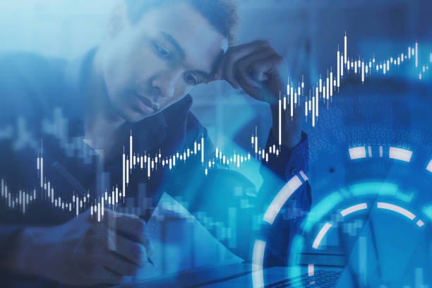 istock African man in office, graph and HUD 1266571643