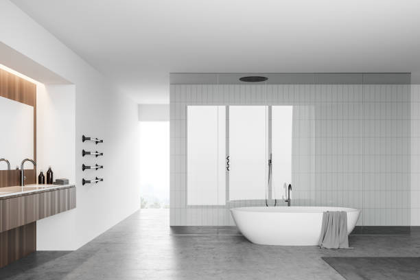 istock White bathroom with tub, sink and shower 1266571651