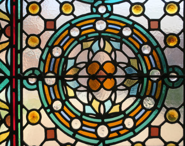 istock multicolored stained glass window with a flower pattern in a circle 1266576999