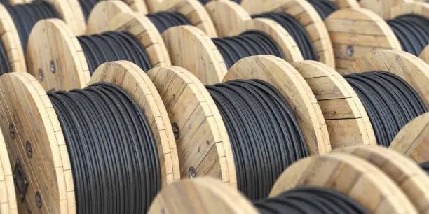 Photo of Warehouse with wooden coil  wire electric cable.