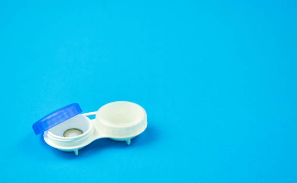 istock Contact lens on blue background 1266579555