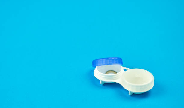 istock Contact lens on blue background 1266579580