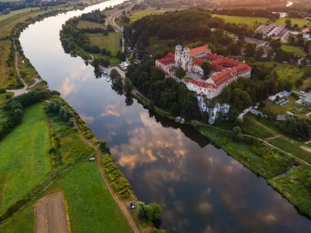 Benedictine Abbey and Monastery on the Hill in Tyniec near Cracow, Poland. Riverside of Vistula River at Sunrise. Drone View.