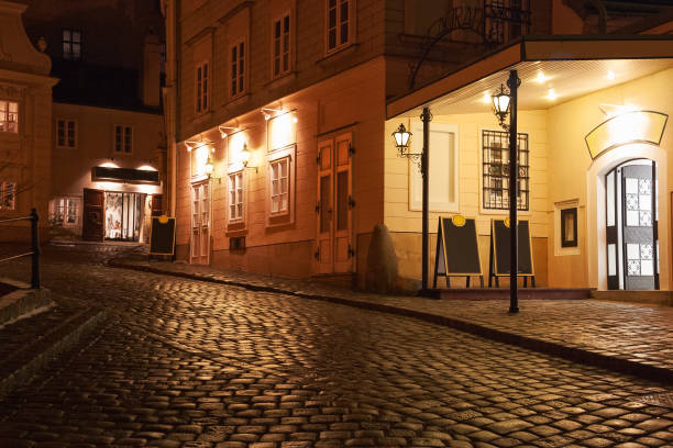 istock Illuminated cobbled street by late  evening ,Vienna , Austria. 1266582871