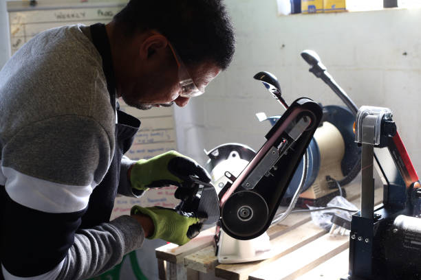 istock A Male Golf Club Builder works in his workshop 1266583775