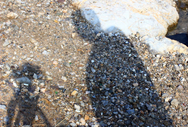 shadow of a man in the sand