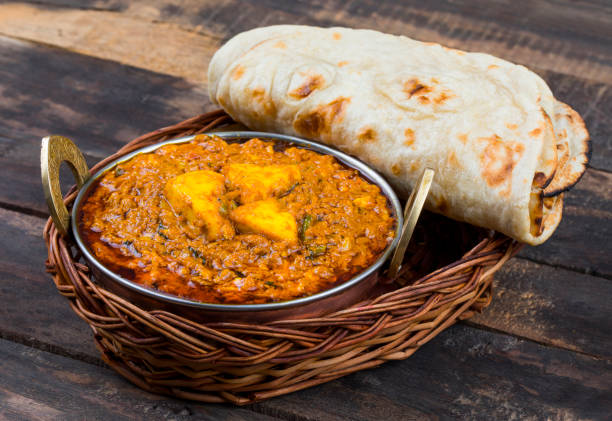 Indian Food Kadai Paneer Served With Dal Makhani, Tandoori or Papad on Wooden Background Indian Food Kadai Paneer Served With Dal Makhani, Tandoori or Papad Also Called Kadhai Paneer or Karahi Paneer is an Indian Dish of Marinated Paneer Cheese Served in Spiced Gravy on Wooden Background karahi stock pictures, royalty-free photos & images