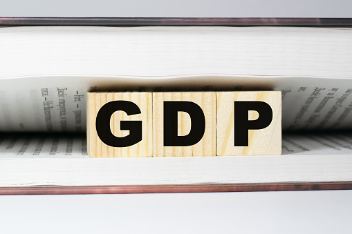 GDP Gross Domestic Product word made with wooden blocks in the book concept