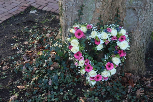 istock Heart shaped sympathy flowers 1266586033