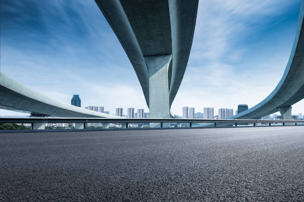 istock Clear sky, highway pavement under the overpass 1266587160