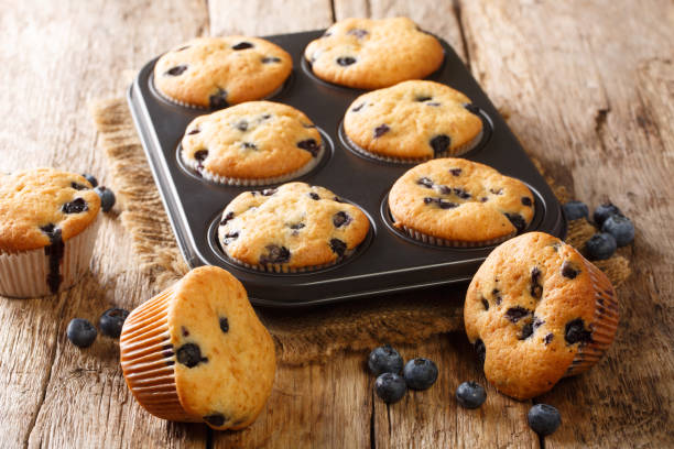 istock Delicate juicy blueberry muffins close-up in a baking dish. horizontal 1266587378