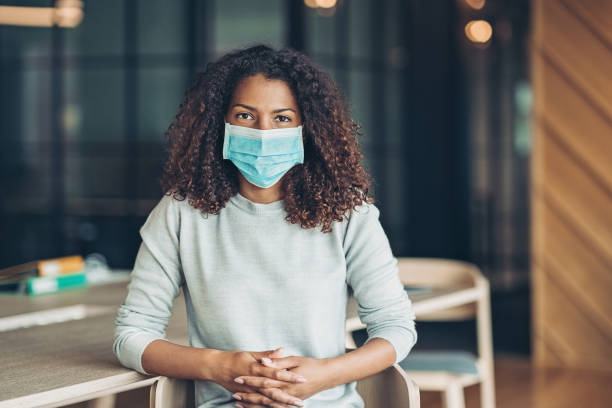 istock African ethnicity woman with a face mask 1266587412
